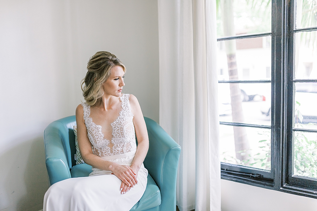 The bride sitting in a chair before her Villa & Vine Wedding ceremony. 