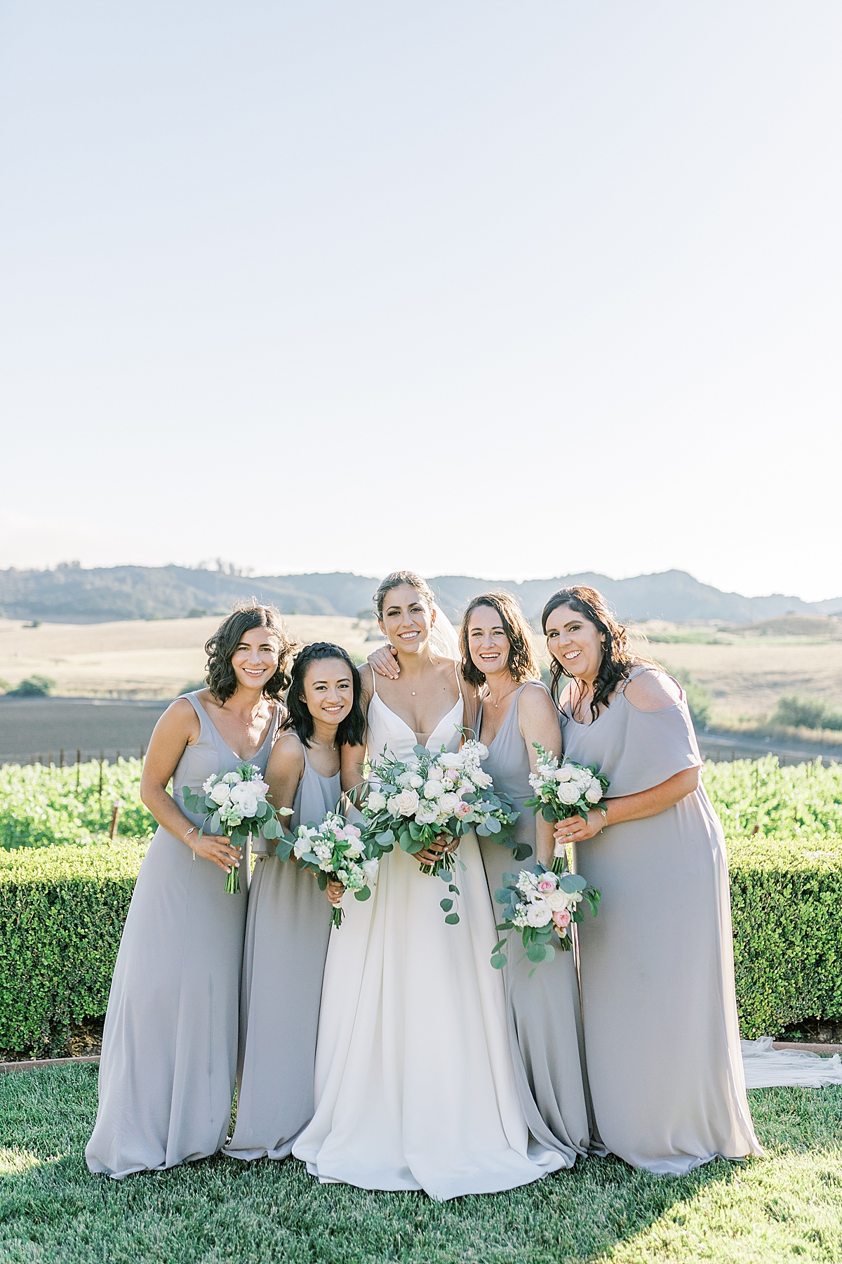 The bride with her bridesmaids at the reception venue after their during their San Luis Obispo Mission wedding ceremony. 