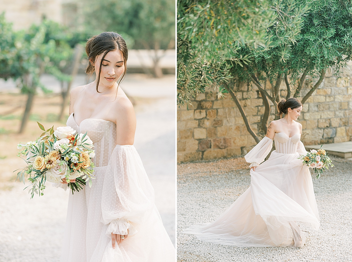 The bride showing off her beautiful polka dotted wedding gown under a couple of olive trees at this Sunstone Villa Wedding editorial.