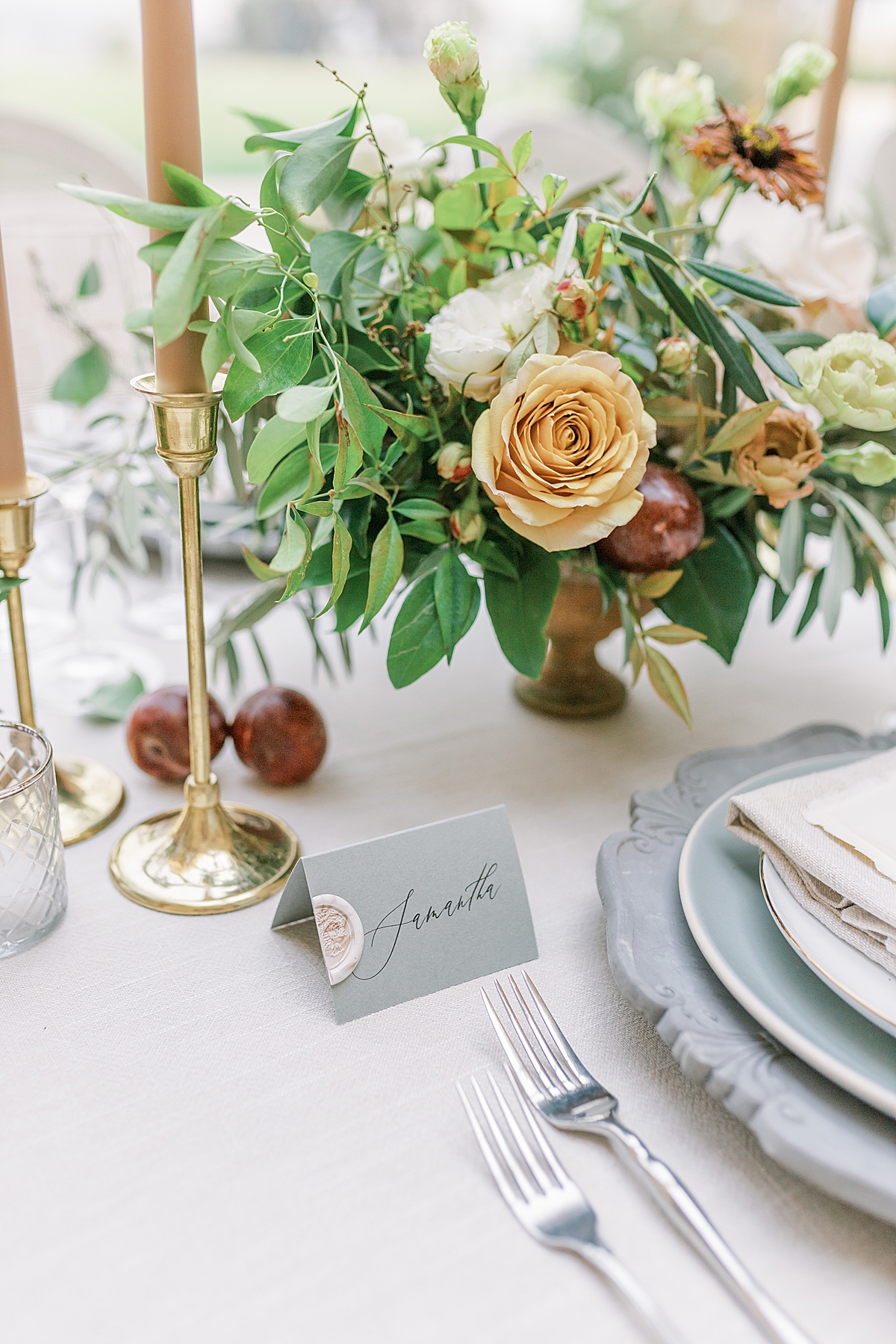 A place setting and name tag on the reception table at this Sunstone Villa Wedding editorial.