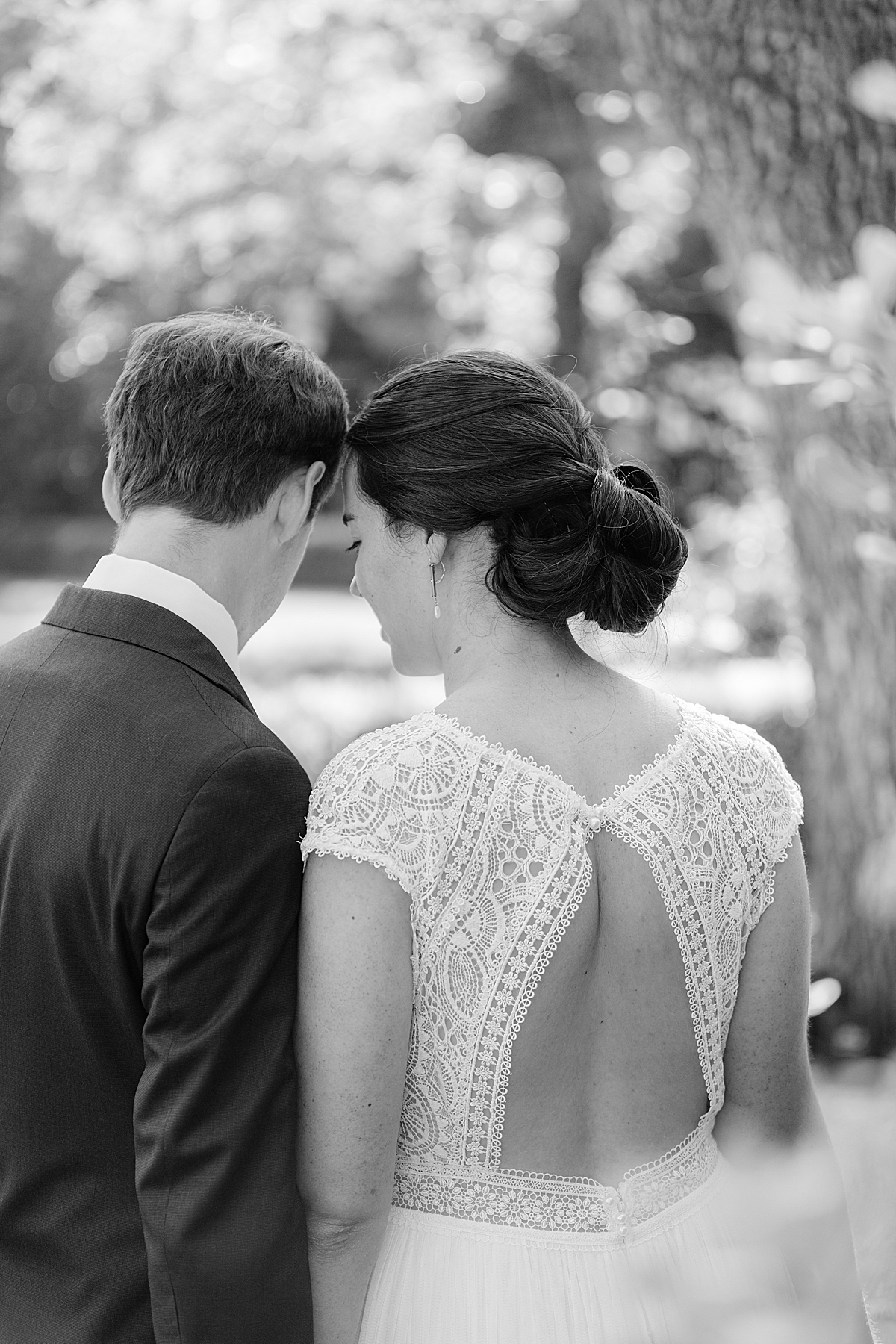 Katharine & John touching foreheads as they hold hands during their private estate wedding in Ojai, California