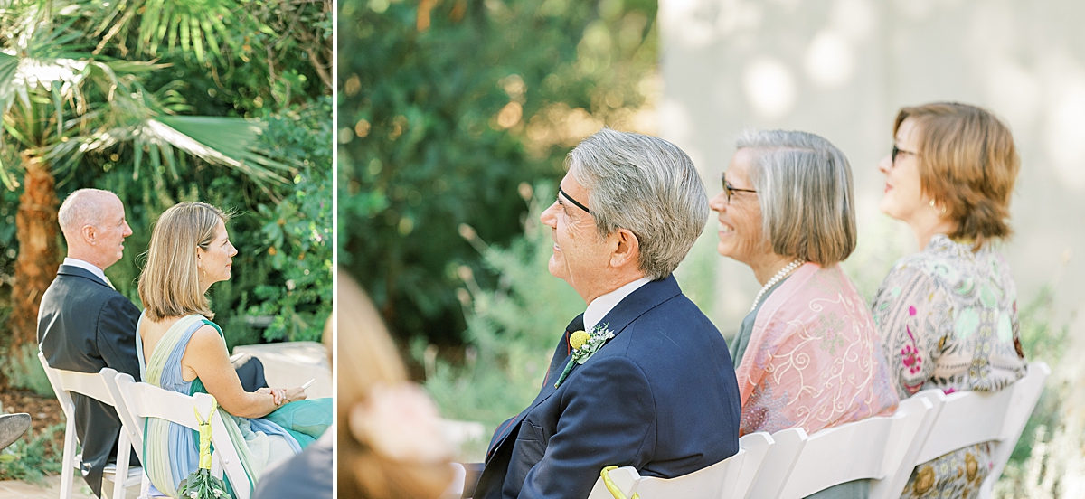 The couple's parents smiling at their children who are standing at the altar.