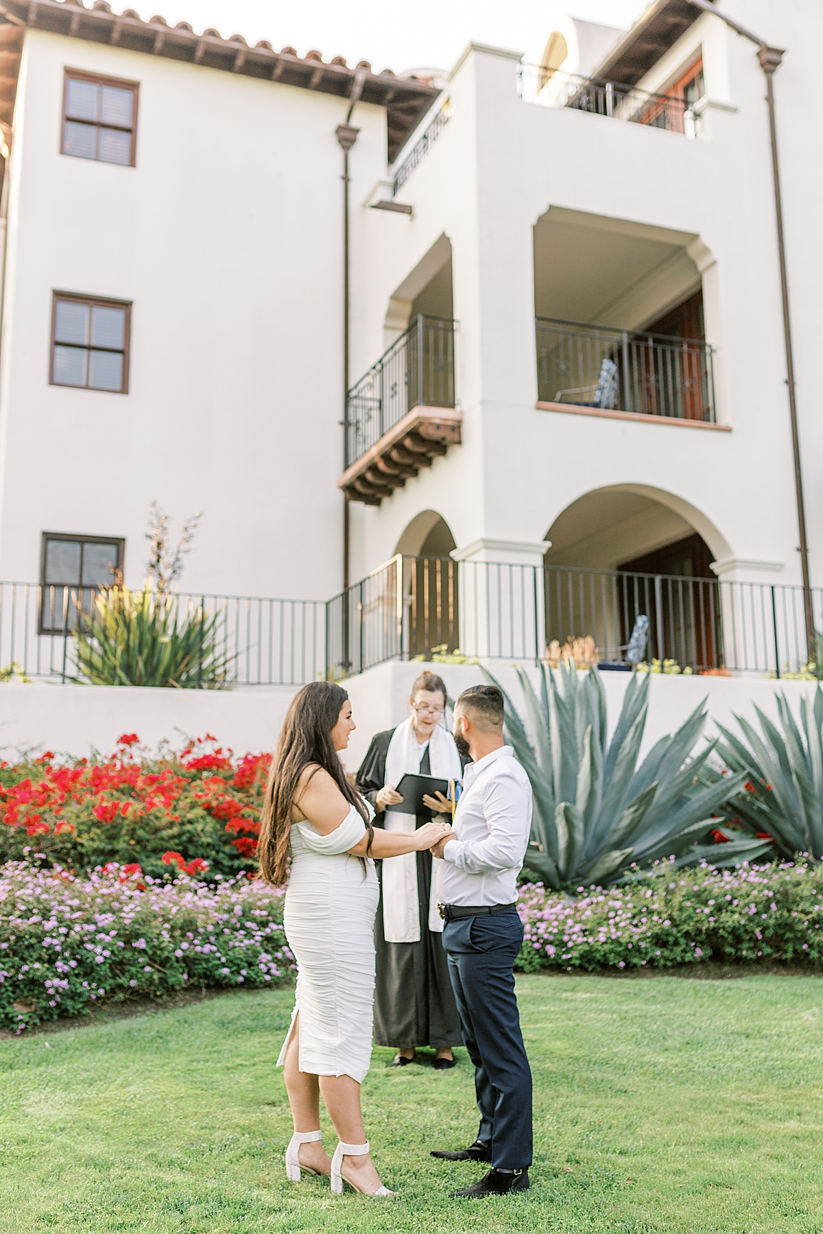 Bella & Omid holding hands during their ceremony at the Ritz-Carlton Bacara in Santa Barbara