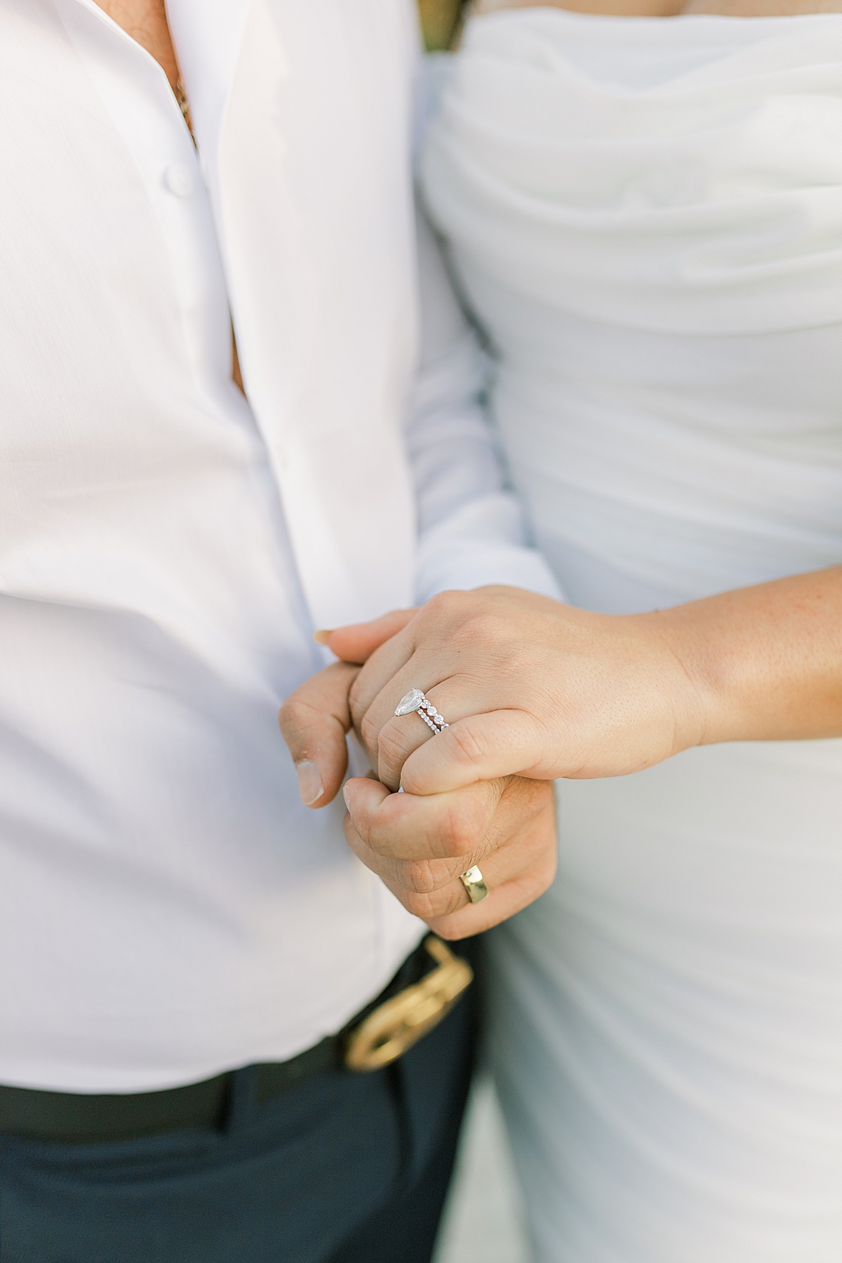 A close up image of the couple holding hands and showing off their rings during their Santa Barbara Elopement at the Ritz-Carlton Bacara 