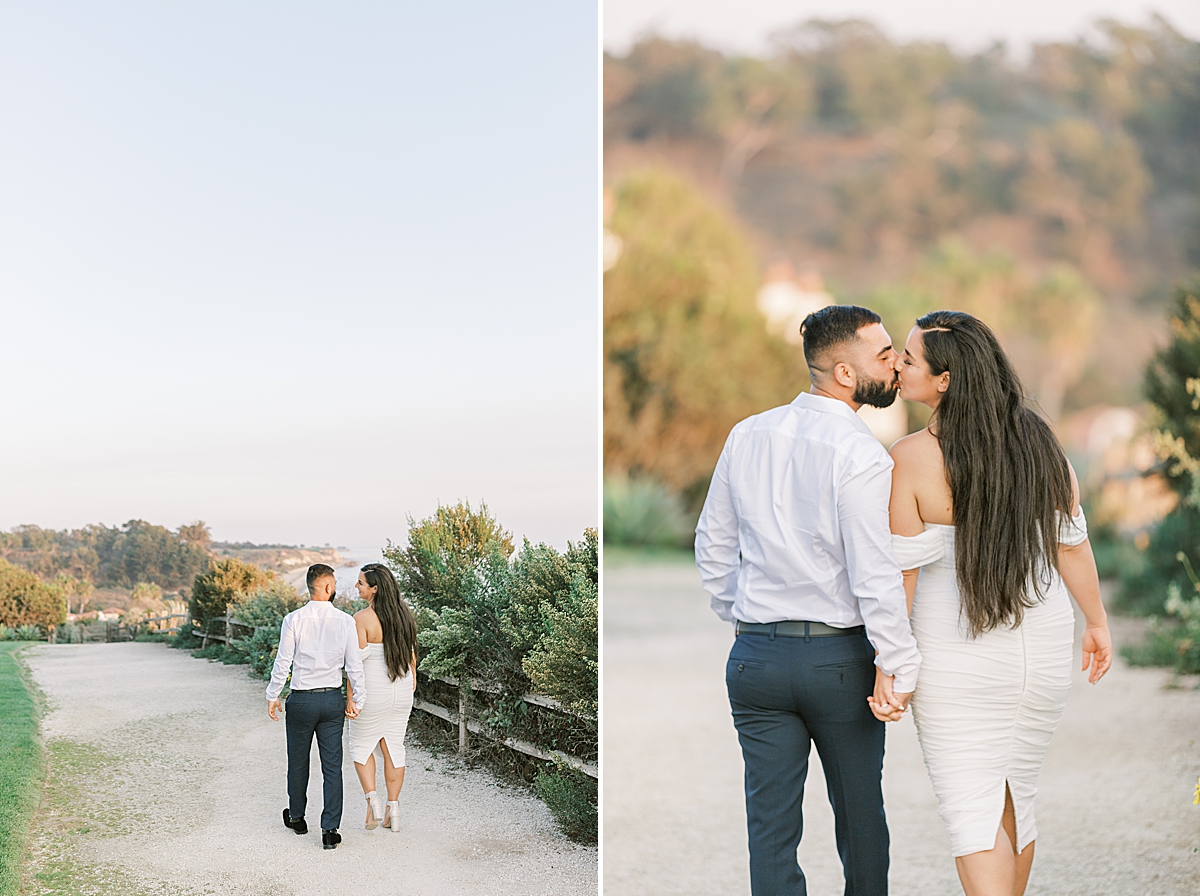 The couple holding hands and walking along the pathway above the ocean and the beach below. A second image of the couple sharing a kiss while holding hands at their Santa Barbara Elopement