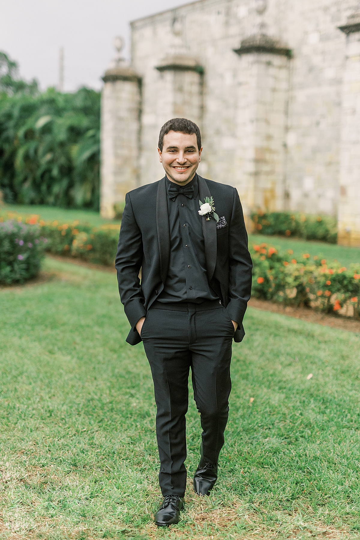 An image of the groom smiling at the camera.