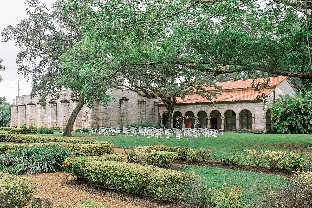 The couple's Ancient Spanish Monastery Wedding ceremony setup in the gardens.