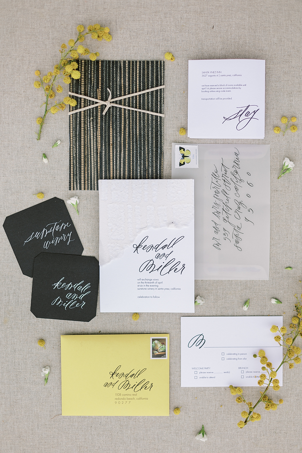 The couple's yellow and black invitation suite to complement their wedding colors.